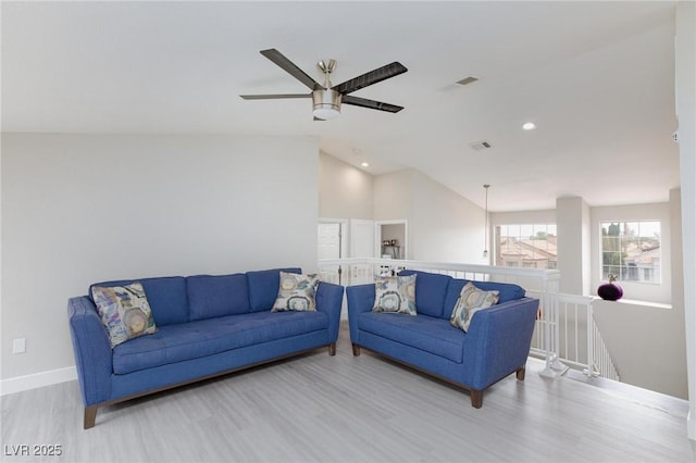 9836 Russett Wood Cir, Las Vegas, NV 89117 - living area featuring wood finished floors, ceiling fan, vaulted ceiling, and recessed lighting