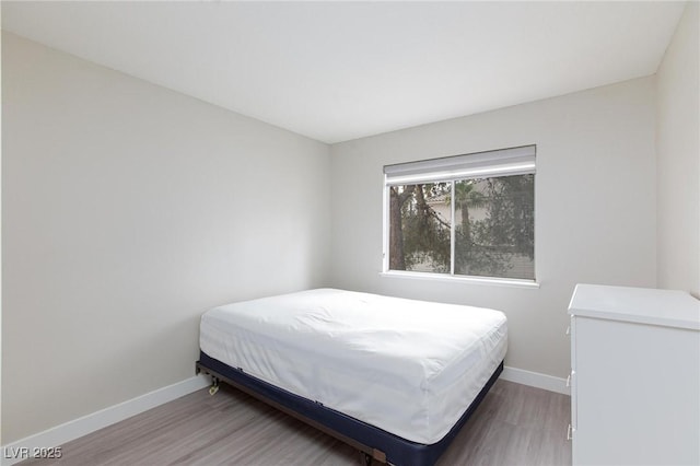 9836 Russett Wood Cir, Las Vegas, NV 89117 - bedroom with wood finished floors and baseboards