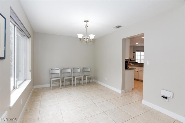 9836 Russett Wood Cir, Las Vegas, NV 89117 - dining space featuring a chandelier and light tile patterned flooring