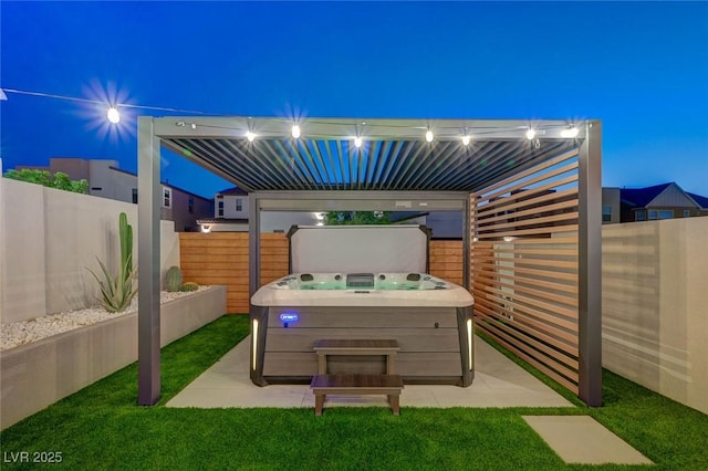2670 Skylark Trail St, Henderson, NV 89044 - patio at twilight with a hot tub, a fenced backyard, and a patio