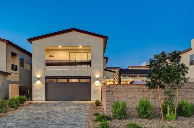 2670 Skylark Trail St, Henderson, NV 89044 - contemporary house with a garage, stucco siding, driveway, and a balcony