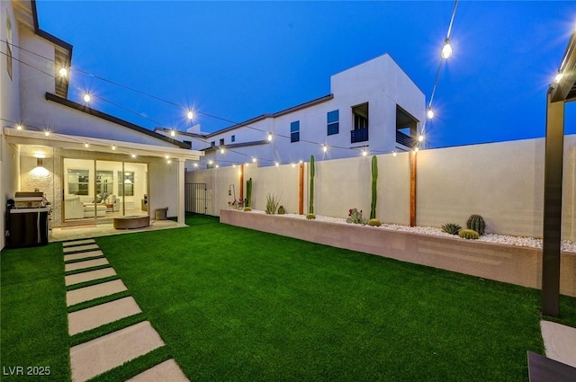 2670 Skylark Trail St, Henderson, NV 89044 - yard at twilight with a patio