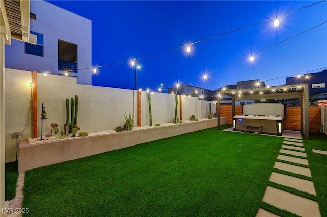 2670 Skylark Trail St, Henderson, NV 89044 - yard at night with a fenced backyard and a hot tub