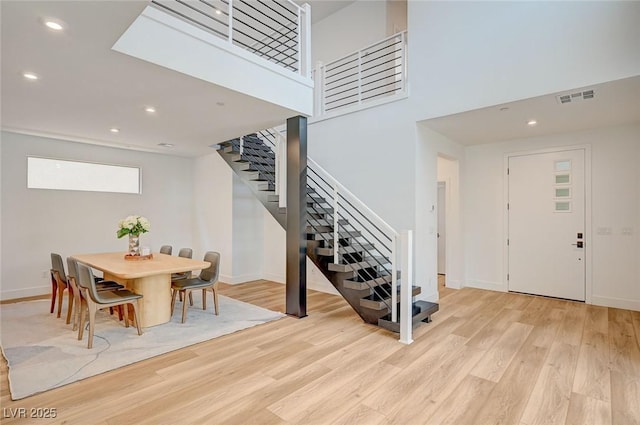 2670 Skylark Trail St, Henderson, NV 89044 - foyer entrance with stairway, light wood-style floors, recessed lighting, and a towering ceiling