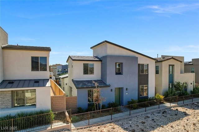 2670 Skylark Trail St, Henderson, NV 89044 - contemporary house featuring stucco siding, a standing seam roof, and a metal roof