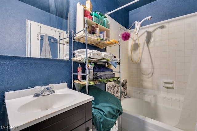 4300 N Lamont St Unit 275, Las Vegas, NV 89115 - bathroom featuring a textured wall, shower / tub combo with curtain, and vanity