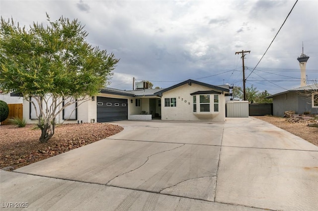 1705 Ivanhoe Way, Las Vegas, NV 89102 - single story home with concrete driveway, an attached garage, and stucco siding