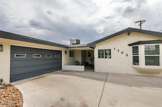 1705 Ivanhoe Way, Las Vegas, NV 89102 - view of front of home featuring stucco siding, an attached garage, and concrete driveway