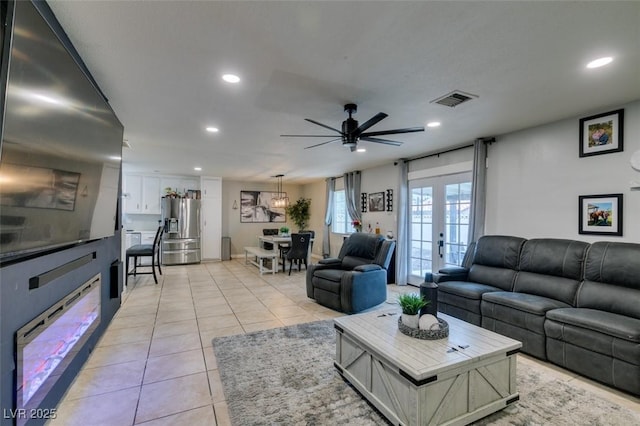 1705 Ivanhoe Way, Las Vegas, NV 89102 - living area featuring recessed lighting, light tile patterned floors, a ceiling fan, and french doors