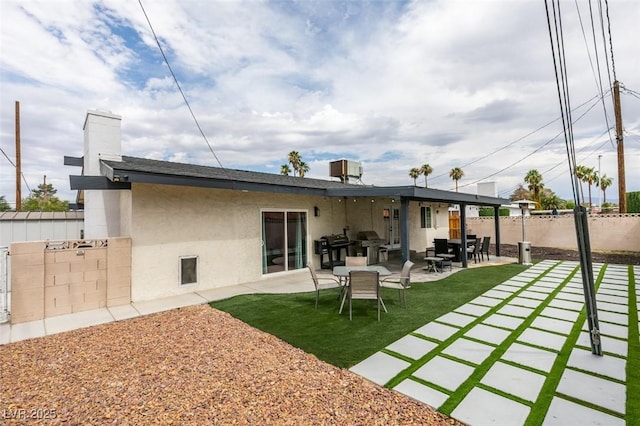 1705 Ivanhoe Way, Las Vegas, NV 89102 - back of house with a fenced backyard, stucco siding, and a patio