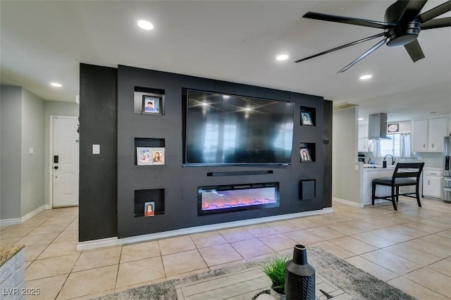 1705 Ivanhoe Way, Las Vegas, NV 89102 - living area featuring ceiling fan, light tile patterned flooring, a glass covered fireplace, and recessed lighting