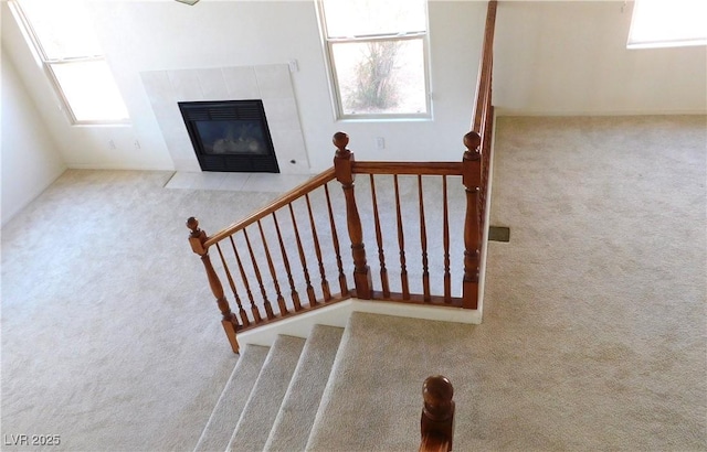 2587 Mizzoni Cir, Henderson, NV 89052 - stairs featuring carpet flooring and a tiled fireplace