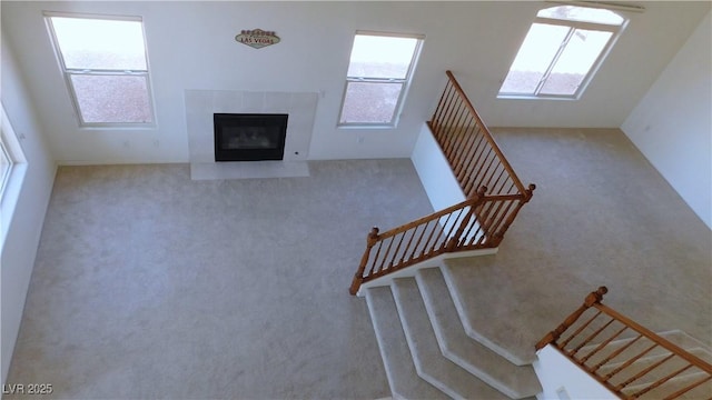 2587 Mizzoni Cir, Henderson, NV 89052 - stairs with carpet and a tiled fireplace