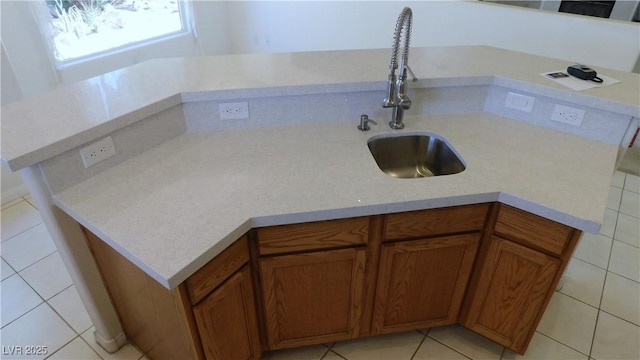 2587 Mizzoni Cir, Henderson, NV 89052 - kitchen featuring brown cabinets and light tile patterned floors