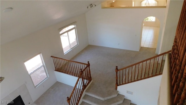2587 Mizzoni Cir, Henderson, NV 89052 - stairway with carpet and a towering ceiling