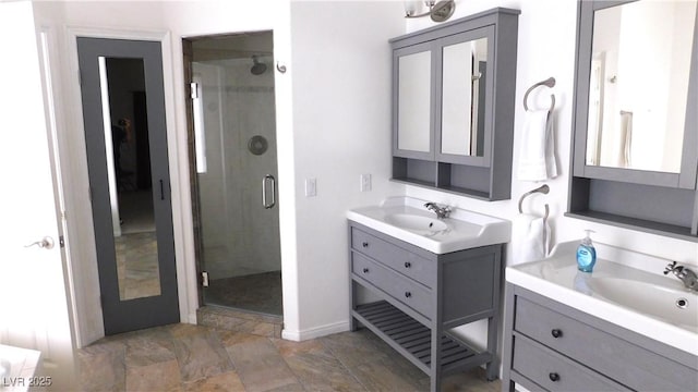 2587 Mizzoni Cir, Henderson, NV 89052 - bathroom featuring two vanities and a shower stall