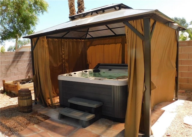 2587 Mizzoni Cir, Henderson, NV 89052 - view of patio / terrace with a hot tub and a gazebo