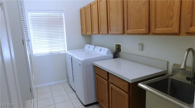 2587 Mizzoni Cir, Henderson, NV 89052 - laundry room featuring washing machine and clothes dryer, cabinet space, and light tile patterned flooring
