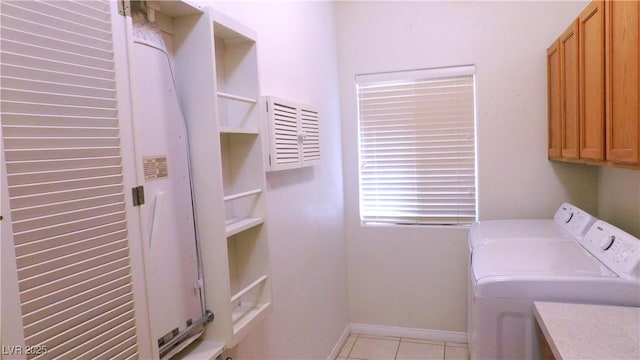 2587 Mizzoni Cir, Henderson, NV 89052 - washroom featuring washing machine and clothes dryer, cabinet space, and light tile patterned floors