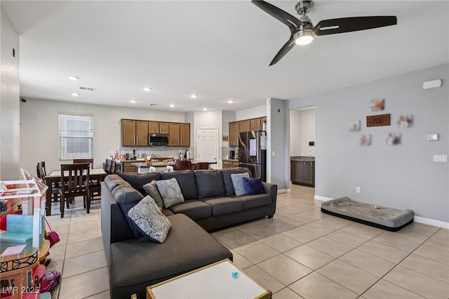 5246 Belmont Mill Ct, Las Vegas, NV 89122 - living area with light tile patterned floors, a ceiling fan, and recessed lighting