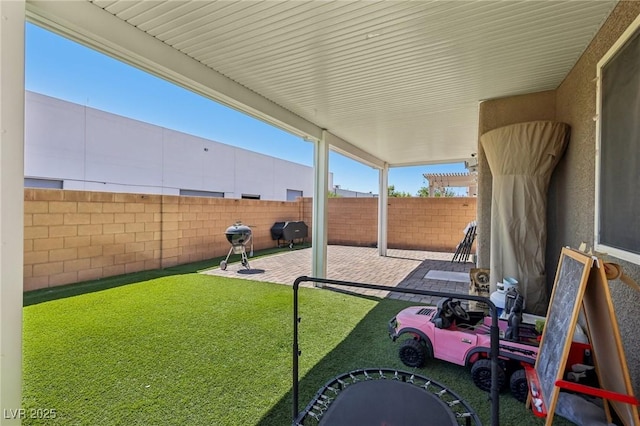 5246 Belmont Mill Ct, Las Vegas, NV 89122 - fenced backyard with a patio