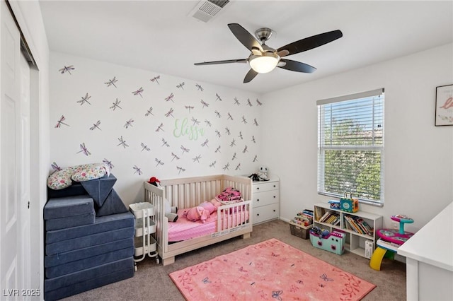 5246 Belmont Mill Ct, Las Vegas, NV 89122 - bedroom featuring carpet flooring, a nursery area, a ceiling fan, and a closet