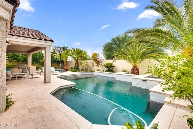 5681 Exotic Rosette Ave, Las Vegas, NV 89139 - view of swimming pool with exterior kitchen, a fenced backyard, a patio, and outdoor lounge area