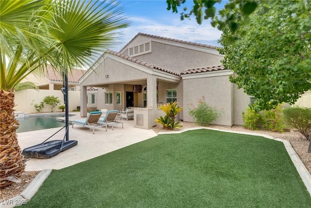5681 Exotic Rosette Ave, Las Vegas, NV 89139 - back of house with stucco siding and a patio