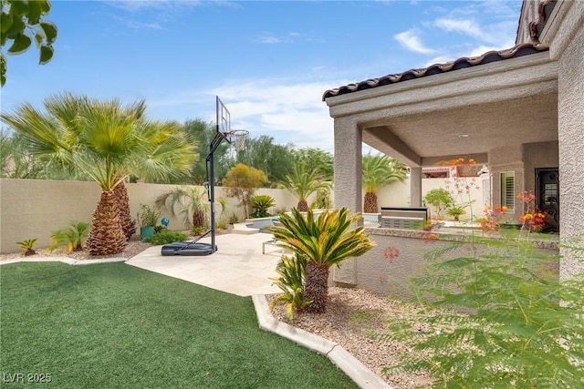 5681 Exotic Rosette Ave, Las Vegas, NV 89139 - fenced backyard featuring a patio