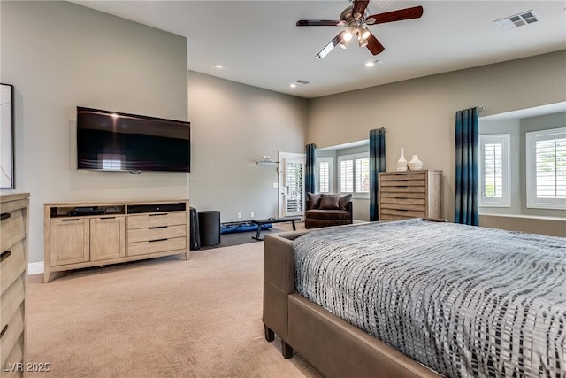 5681 Exotic Rosette Ave, Las Vegas, NV 89139 - bedroom with light colored carpet, multiple windows, recessed lighting, and ceiling fan