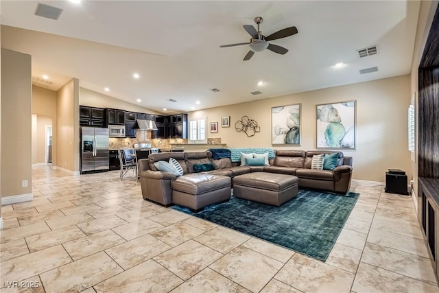 5681 Exotic Rosette Ave, Las Vegas, NV 89139 - living room featuring lofted ceiling, ceiling fan, recessed lighting, and arched walkways