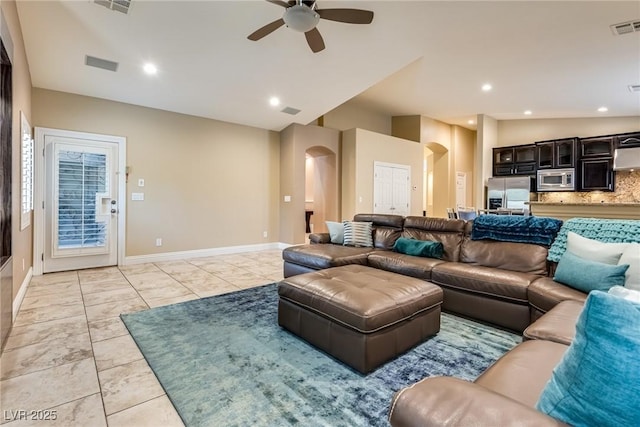 5681 Exotic Rosette Ave, Las Vegas, NV 89139 - living room with arched walkways and ceiling fan
