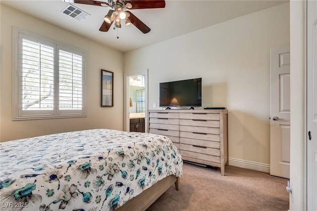 5681 Exotic Rosette Ave, Las Vegas, NV 89139 - bedroom with light colored carpet, a ceiling fan, and connected bathroom