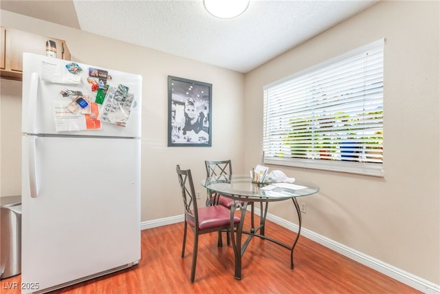 2666 Aarondavid Dr, Las Vegas, NV 89121 - dining space featuring wood finished floors and a textured ceiling