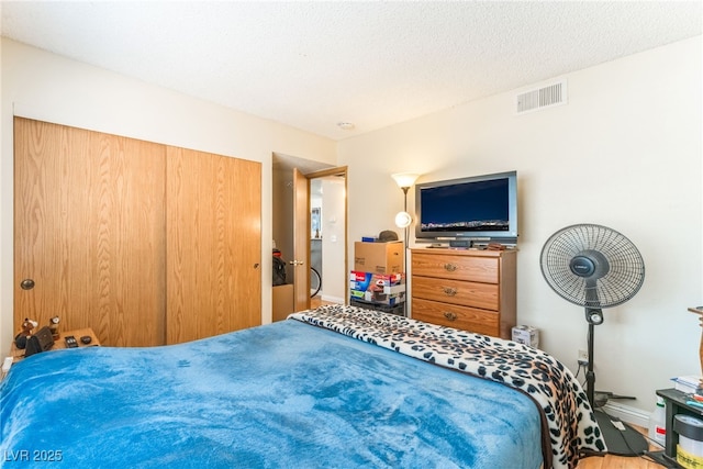 2666 Aarondavid Dr, Las Vegas, NV 89121 - bedroom with a closet and wood finished floors