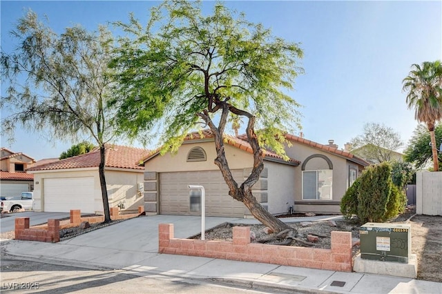 1005 Transom Dr, Las Vegas, NV 89128 - mediterranean / spanish home featuring driveway, stucco siding, a garage, and a tiled roof