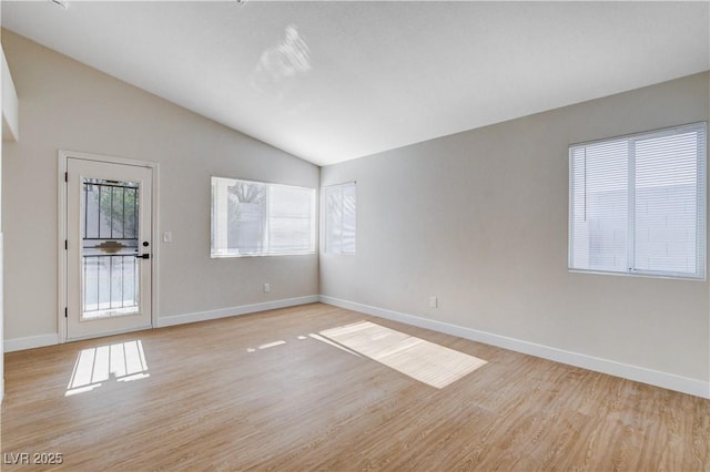 1005 Transom Dr, Las Vegas, NV 89128 - unfurnished room with lofted ceiling and light wood-style floors