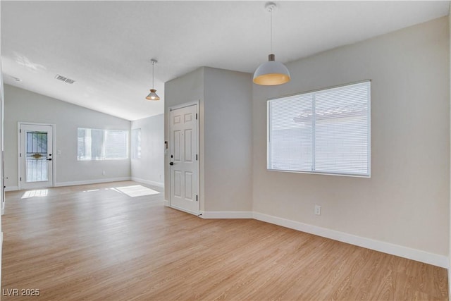 1005 Transom Dr, Las Vegas, NV 89128 - empty room with light wood finished floors and vaulted ceiling