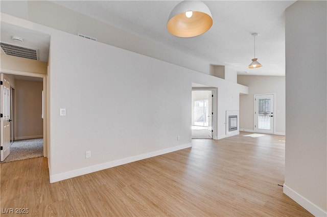 1005 Transom Dr, Las Vegas, NV 89128 - unfurnished living room featuring light wood-style floors