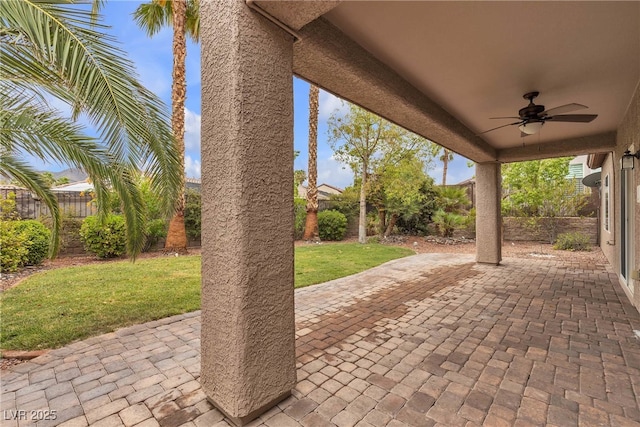 2244 Savannah River St, Henderson, NV 89044 - fenced backyard featuring a ceiling fan and a patio area