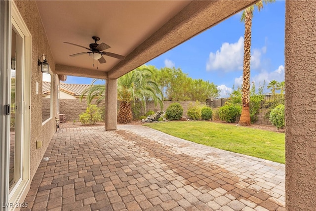 2244 Savannah River St, Henderson, NV 89044 - fenced backyard featuring a ceiling fan and a patio