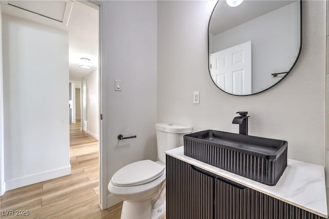 516 Donner St, Las Vegas, NV 89107 - bathroom featuring wood finished floors and toilet