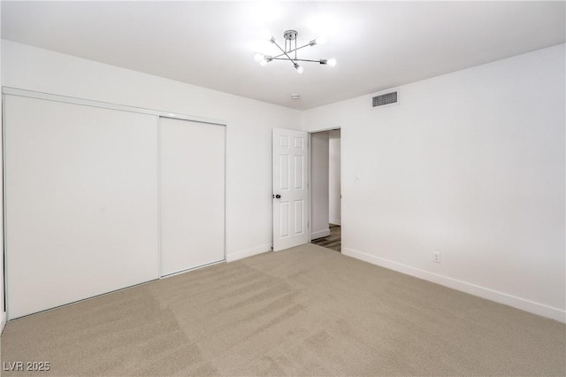 516 Donner St, Las Vegas, NV 89107 - unfurnished bedroom with carpet floors, a chandelier, and a closet
