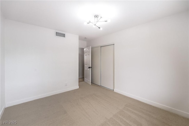 516 Donner St, Las Vegas, NV 89107 - unfurnished bedroom featuring a closet and light colored carpet