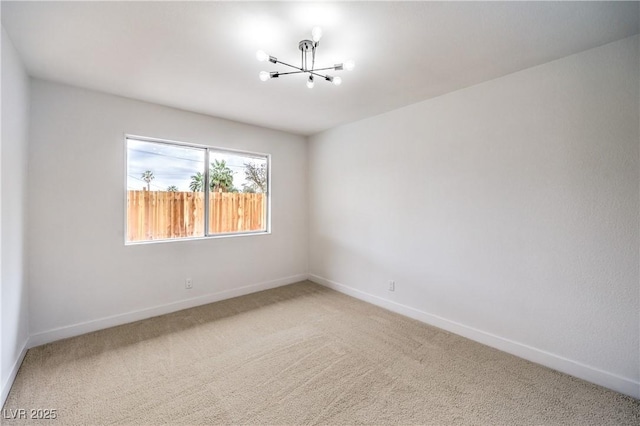 516 Donner St, Las Vegas, NV 89107 - spare room featuring a chandelier and light carpet