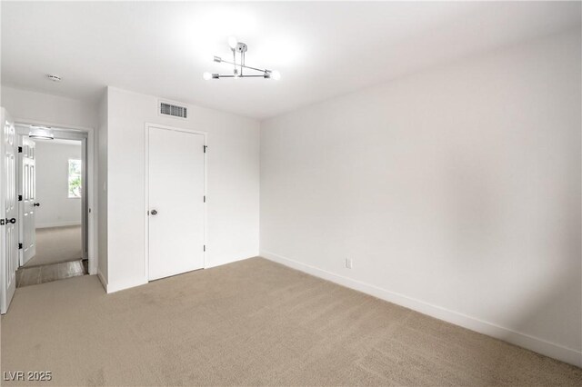 516 Donner St, Las Vegas, NV 89107 - unfurnished bedroom featuring light carpet and a closet
