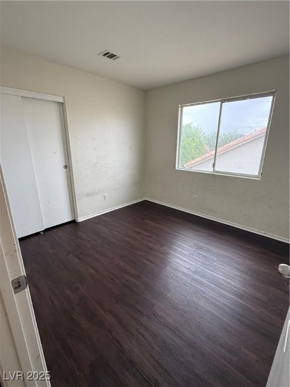 216 Night Fall Ter, Henderson, NV 89015 - unfurnished room with dark wood-type flooring and baseboards