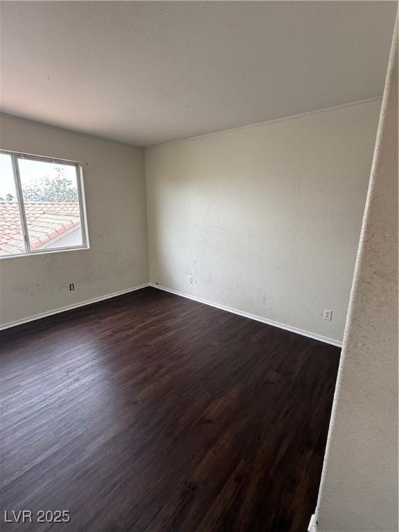 216 Night Fall Ter, Henderson, NV 89015 - empty room with dark wood-style flooring and baseboards