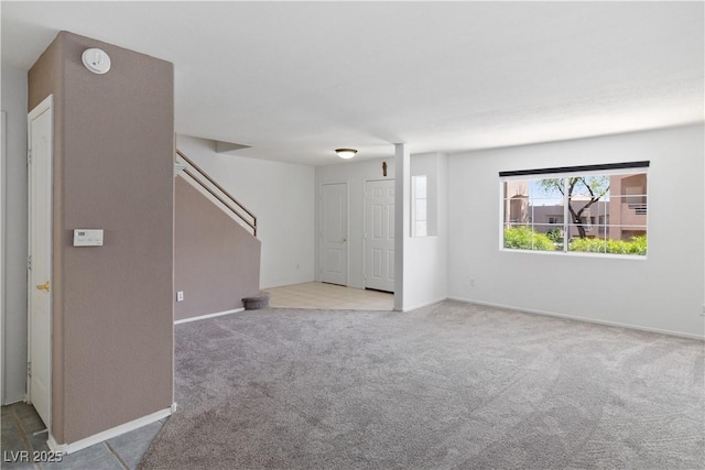 2219 Rugged Mesa Dr, Laughlin, NV 89029 - unfurnished living room with carpet and stairs