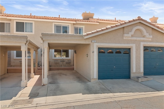 2219 Rugged Mesa Dr, Laughlin, NV 89029 - view of property with stucco siding, a chimney, concrete driveway, and a garage